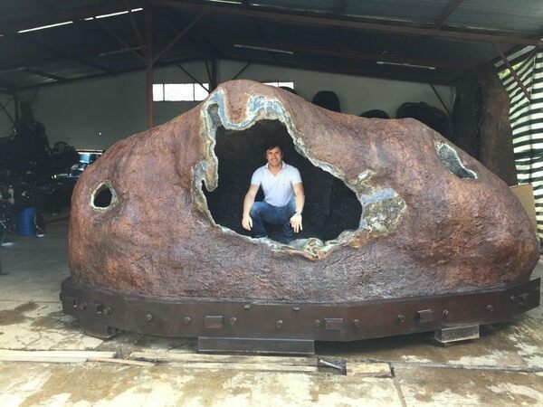 The largest known amethyst geode from Uruguay weighing over 44,000 lbs and measuring 18 feet wide.